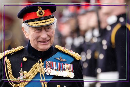 a close up of King Charles smiling and wearing military unifrom ahead of the coronation