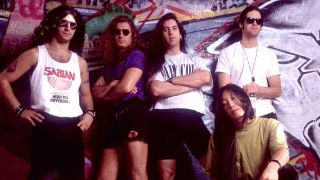 Dream Theater leaning on a graffiti’d wall