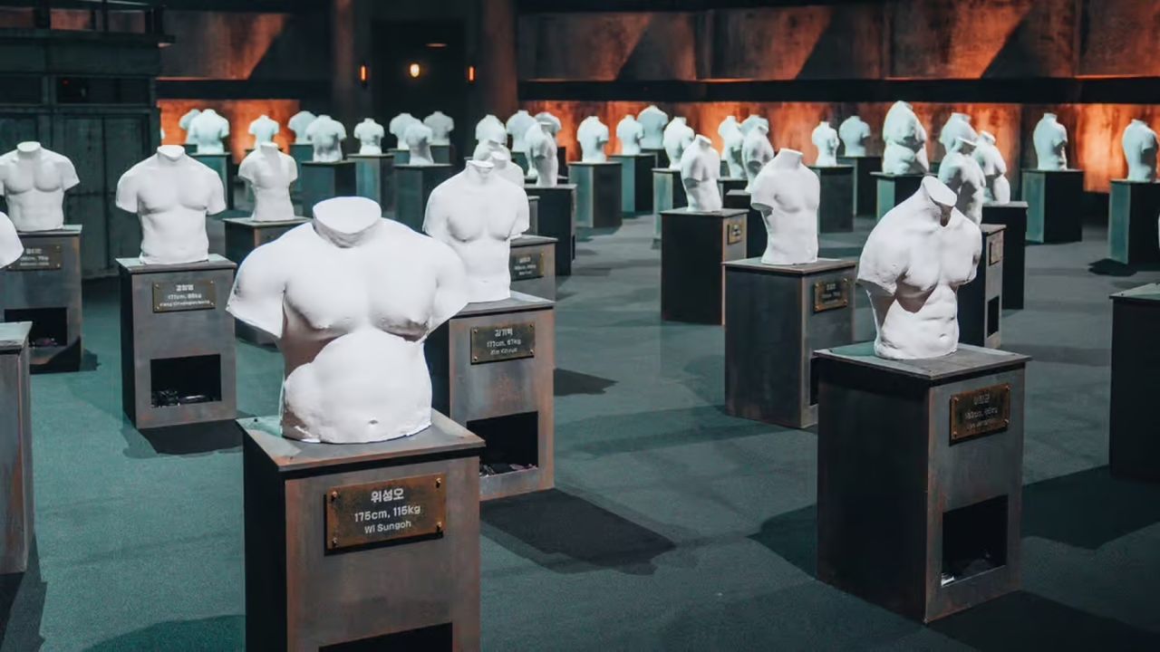 torso busts arranged in a showroom, with plaques underneath, on &#039;physical 100&#039; season 2