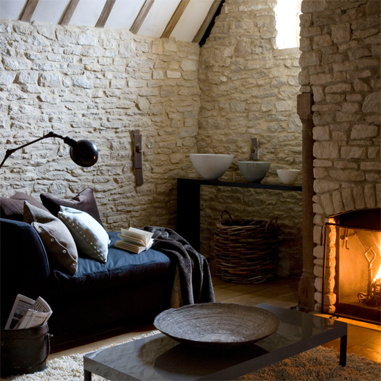 living room with blue sofa and fire place