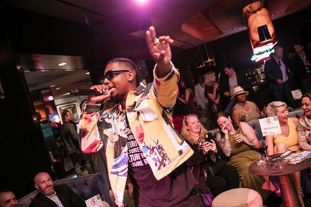 Dexter Kelly performs for attendees of the 40 Under 40 event.