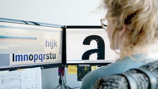 A typographer working on a piece of digital typography