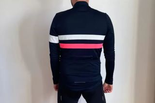 Image shows a cyclist wearing the Rapha Brevet long sleeve jersey.