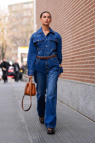 Woman wearing a denim shirt outfit.