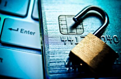 Open security lock on credit cards with computer keyboard / Credit card data breach