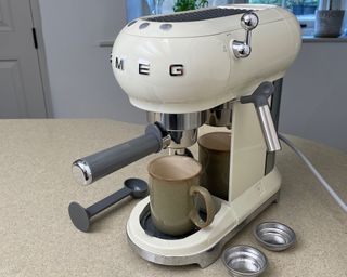 A Smeg ECF01 Espresso Machine on countertop