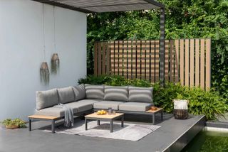 designbotschaft GmbH grey corner sofa on raised patio