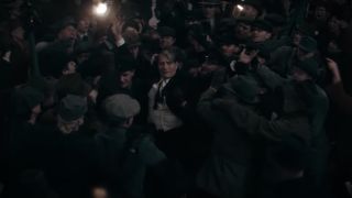 Mads Mikkelsen's Grindelwald surrounded by cheering crows in Fantastic Beasts: The Secrets of Dumbledore
