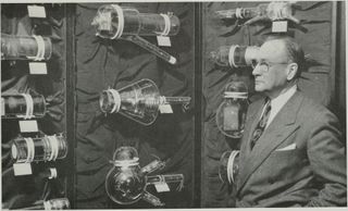 Vladimir K. Zworykin stood next to early experimental video camera tubes in 1954