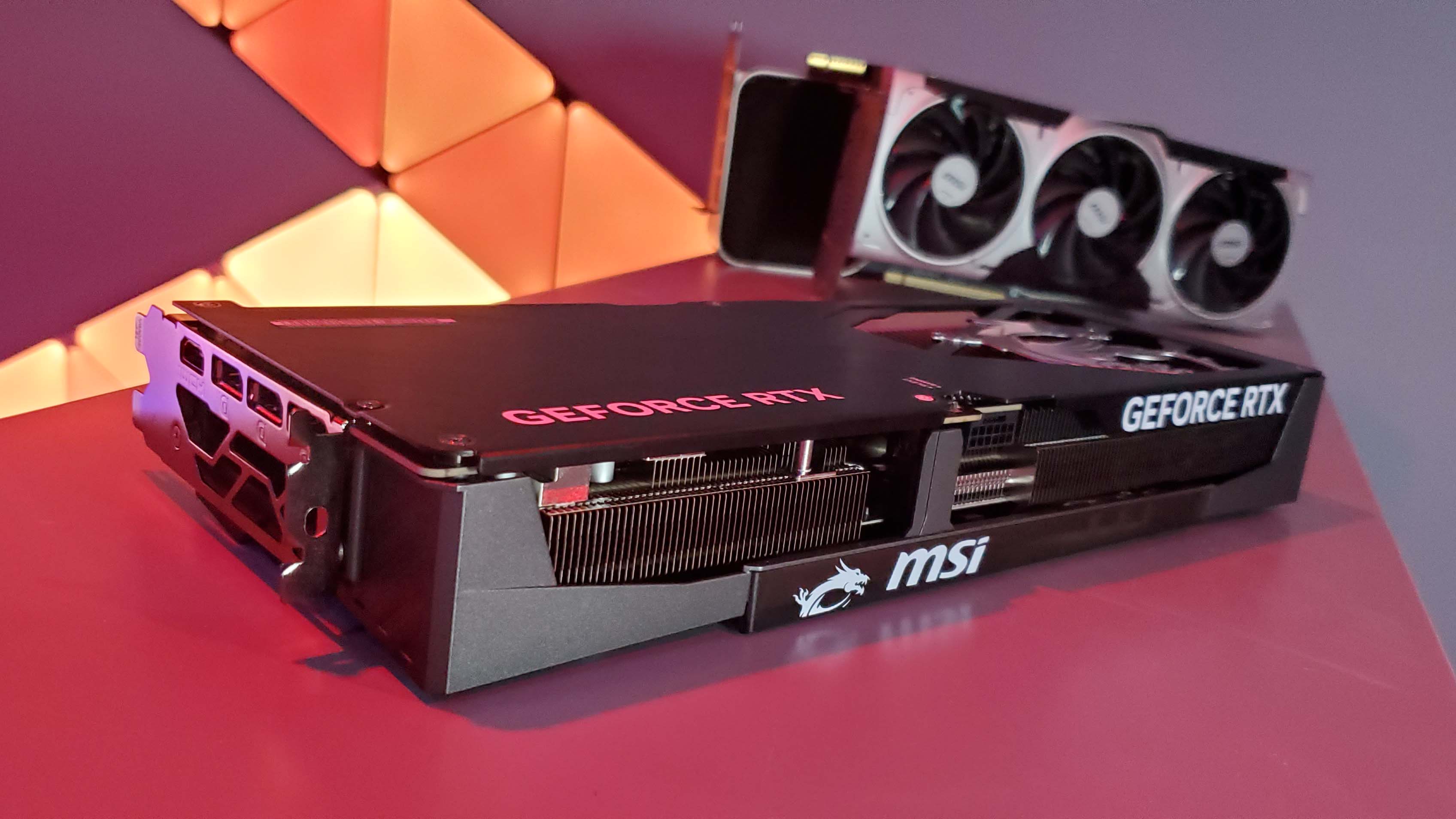 MSI RTX 5070 Ti Gaming Trio OC Plus graphics card under a red light