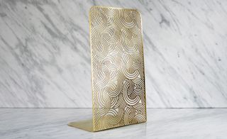 Intricate, gold book end