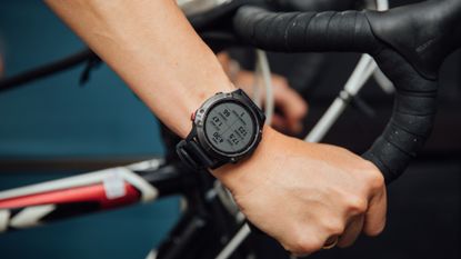 One of the best smartwatches for cycling is shown here worn while cycling.