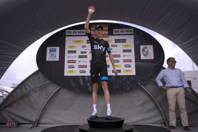 Chris Froome (Sky) salutes from the podium.
