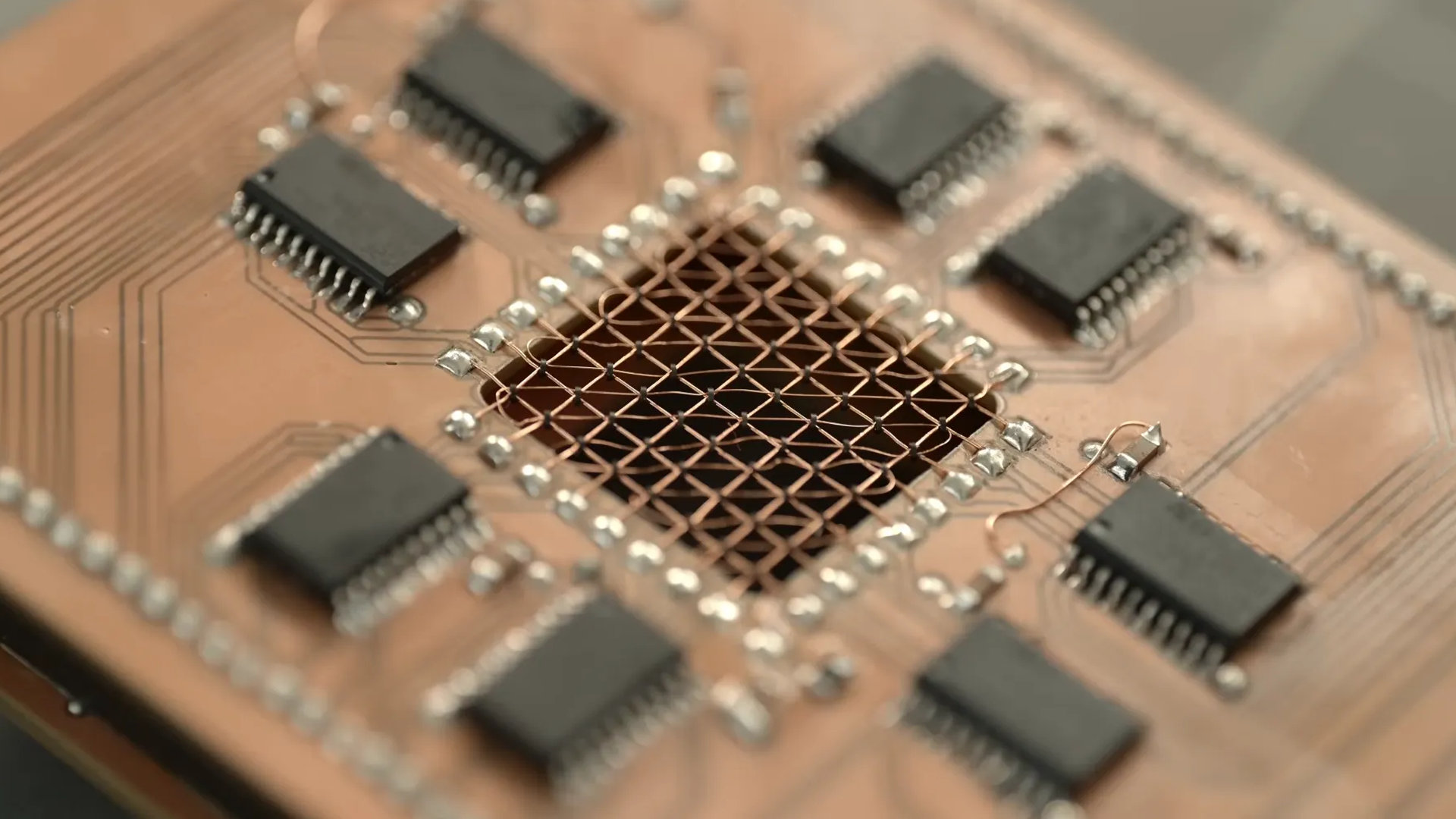 A cropped screenshot of a YouTube video by polymatt, showing the components of a handmade magnetic-core memory USB storage device