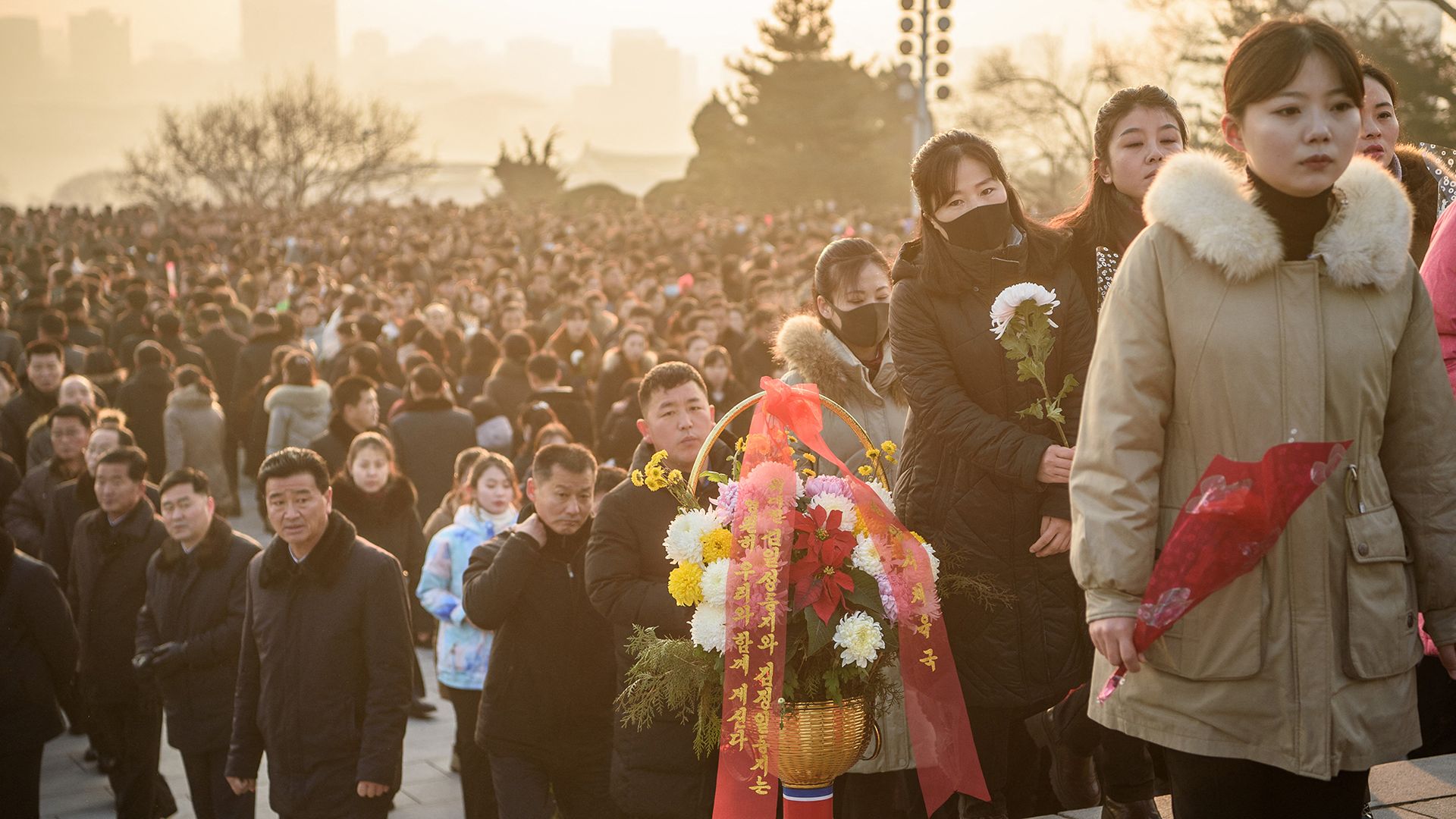 
                                People visit Mansu Hill to lay flowers in memory of Kim Il Sung and Kim Jong Il, in Pyongyang, North Korea
                            