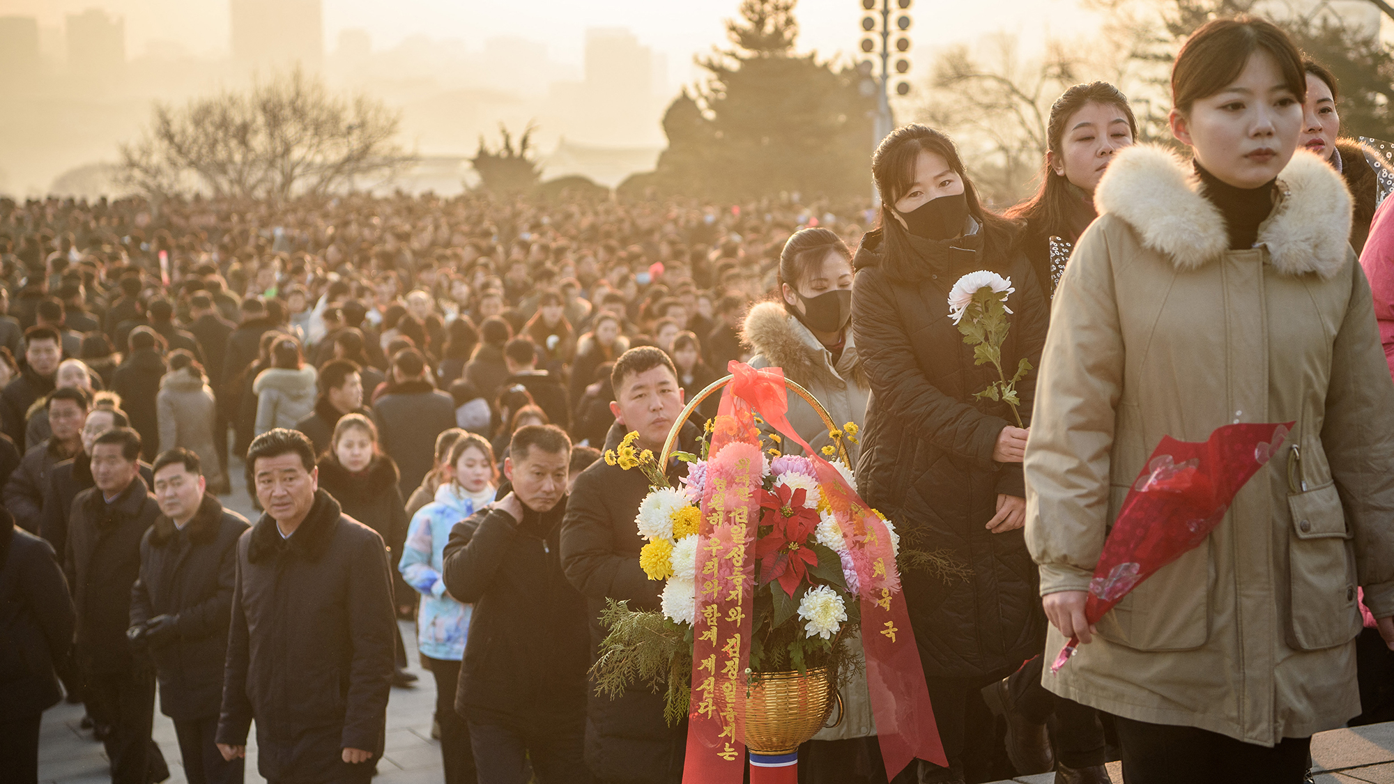 People visit Mansu Hill to lay flowers in memory of Kim Il Sung and Kim Jong Il, in Pyongyang, North Korea