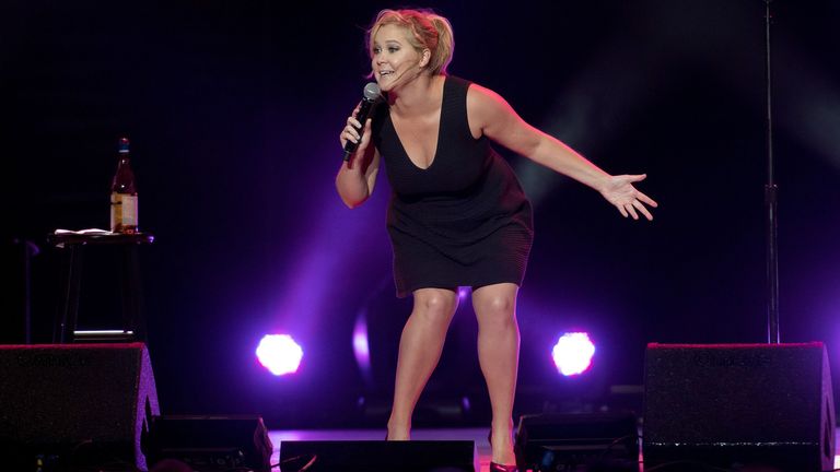 Amy Schumer performing on stage.