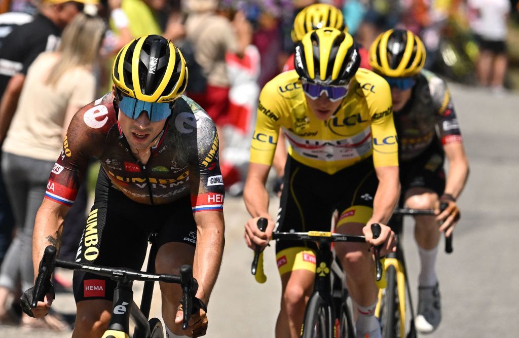 JumboVisma teams Slovenian rider Primoz Roglic L cycles ahead of UAE Team Emirates teams Slovenian rider Tadej Pogacar C wearing the overall leaders yellow jersey during the 11th stage of the 109th edition of the Tour de France cycling race 1517 km between Albertville and Col du Granon Serre Chevalier in the French Alps on July 13 2022 Photo by Marco BERTORELLO AFP Photo by MARCO BERTORELLOAFP via Getty Images