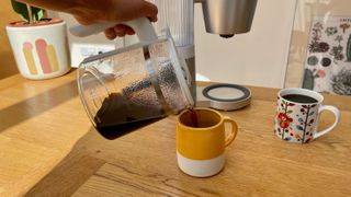 Pouring coffee into a mug