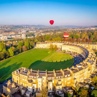 royal crescent with hot air balloon and country side view