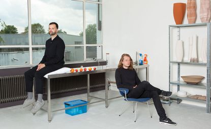 Tijmen Smeulders and Olivier van Herpt's Eindhoven studio, with some of his 3D-printed vases and bowls on display on the metal shelves.