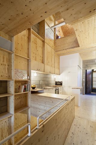 One of the house's voids cuts through the kitchen making the space feel bigger