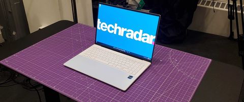 white laptop sitting on desk