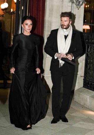 Victoria and David Beckham look elegant in matching looks as they head to the Grand Gala at the Louvre Museum in Paris, France during Paris Fashion Week