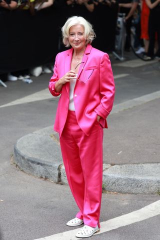 Emma Thompson wearing a pink satin suit