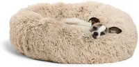 Best dog bed: A small dog lying on the Best Friends by Sheri Luxury Shag Faux Fur Donut Cuddler