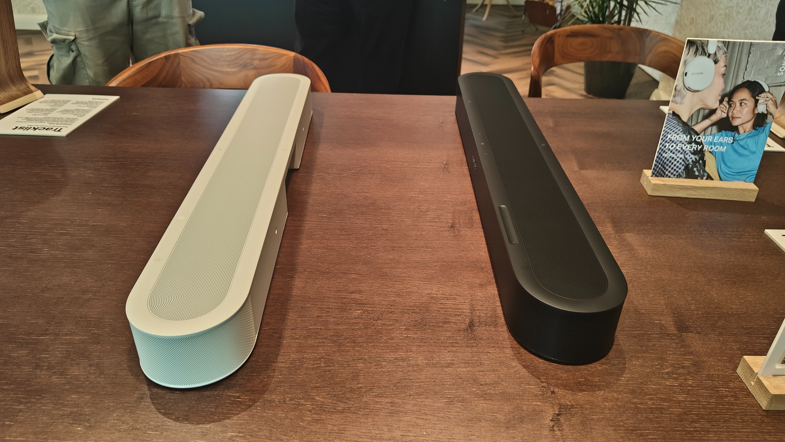 Sonos Beam Ultra on a brown wooden table.