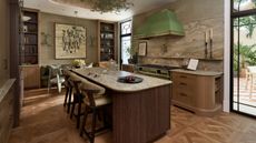 A wooden kitchen with marble countertops