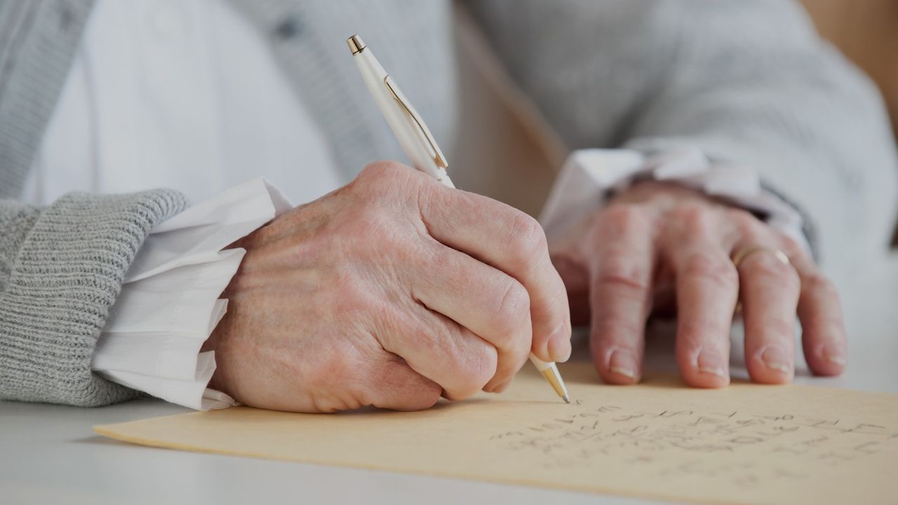 A lady writing a letter