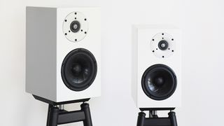 A pair of white Serhan Swift mµ2 Mk II on stands