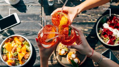 Group of women enjoying low-calorie cocktails on summer&#039;s day