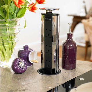 electric socket tower with purple timer