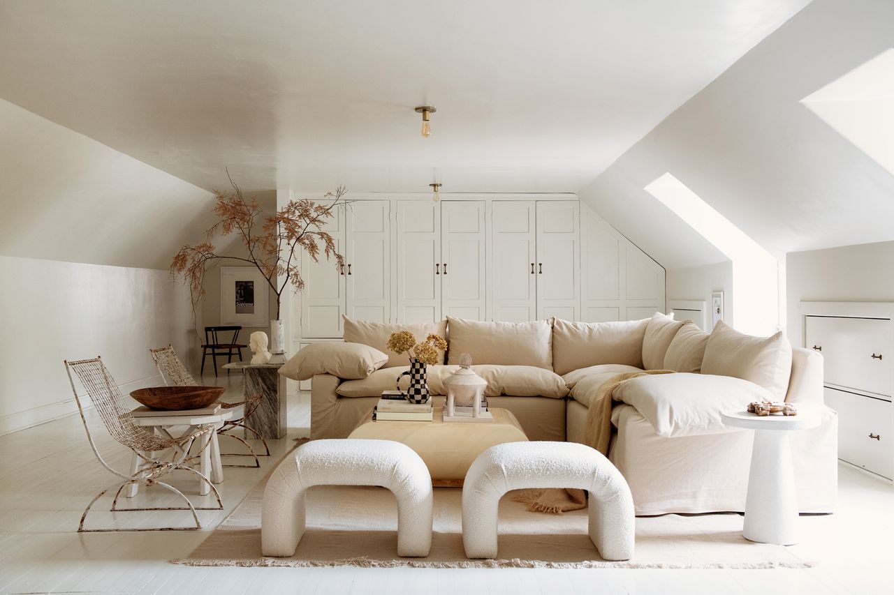 white living room white white sofa and curved white stools