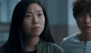 Awkwafina looking troubled in The Farewell