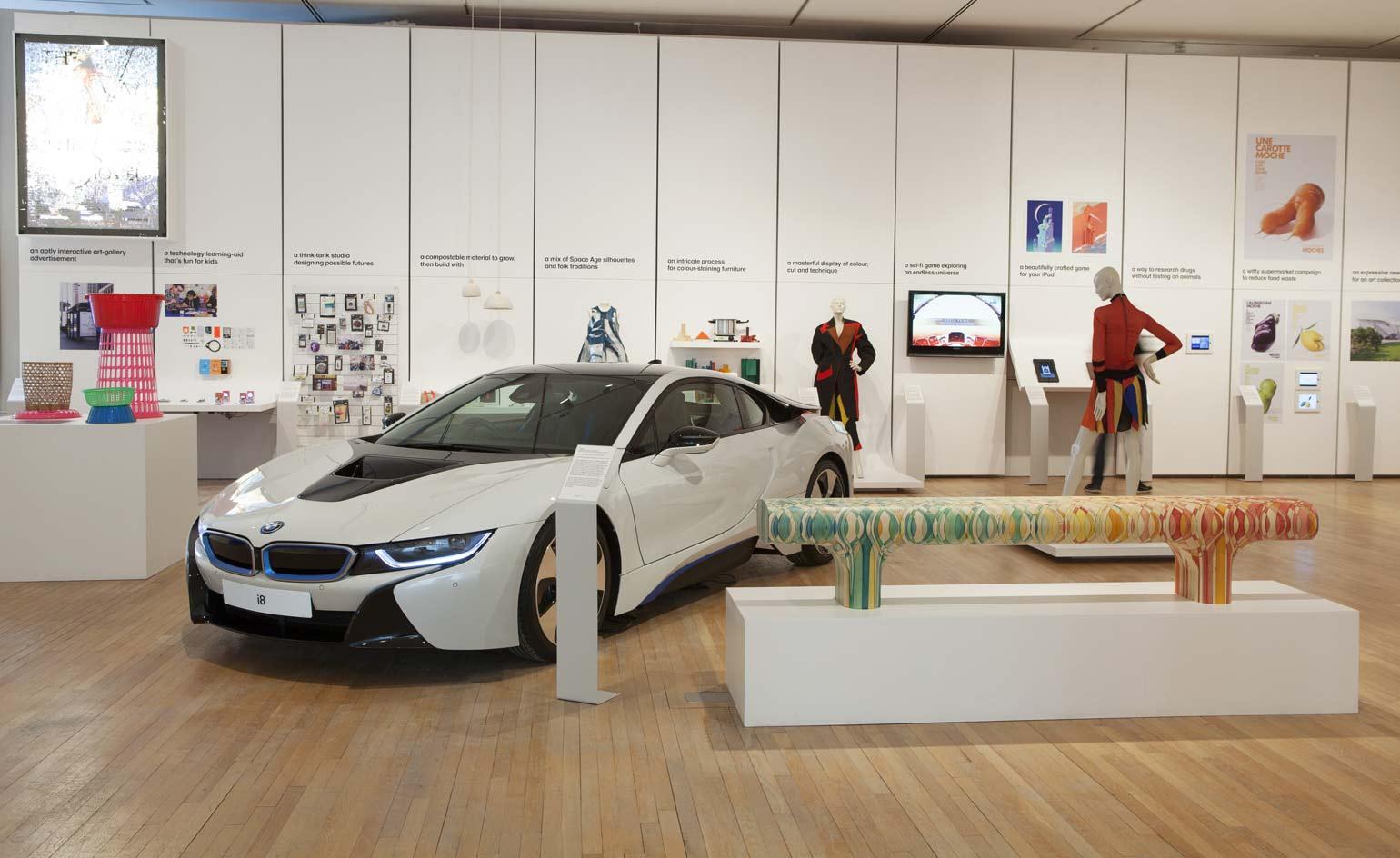 The hulking BMW i8 next to the elegant 'Endgrain', Yael Mer and Shay Alkalay's bench for Raw Edges