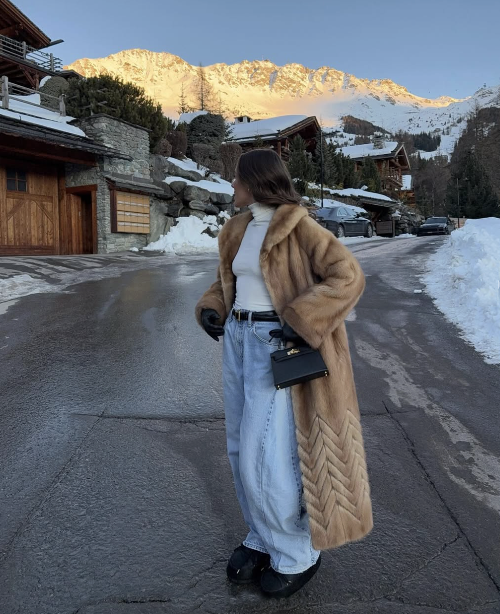 emma leger in jeans and a fur coat