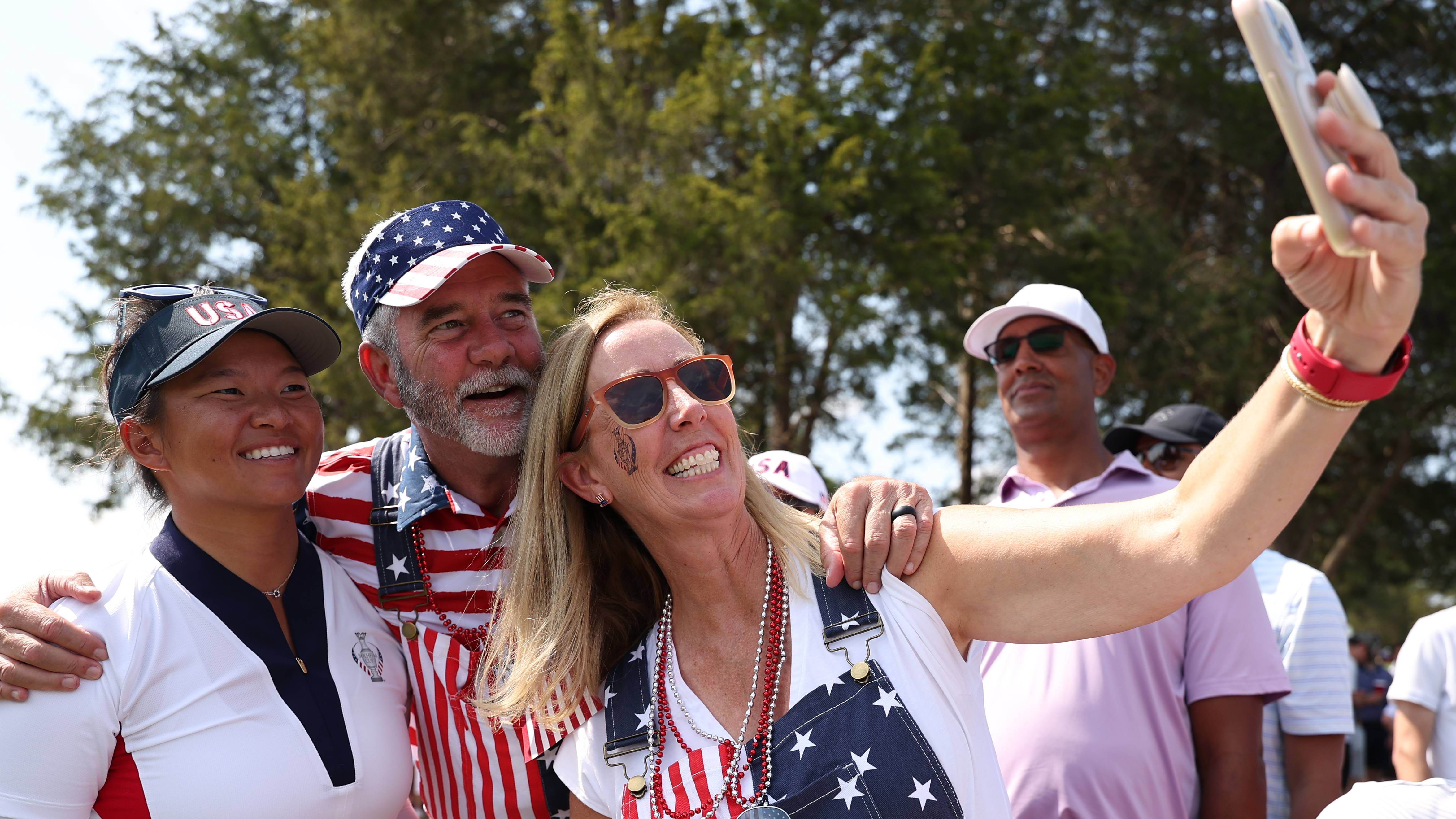 Couple have a selfie with Megan Khang at 2024 Solheim Cup