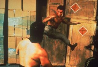 Double Impact - Jean Claude Van Damme in high-kicking action in his 1991 action film.