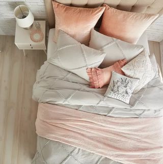 A coral and white bedding set