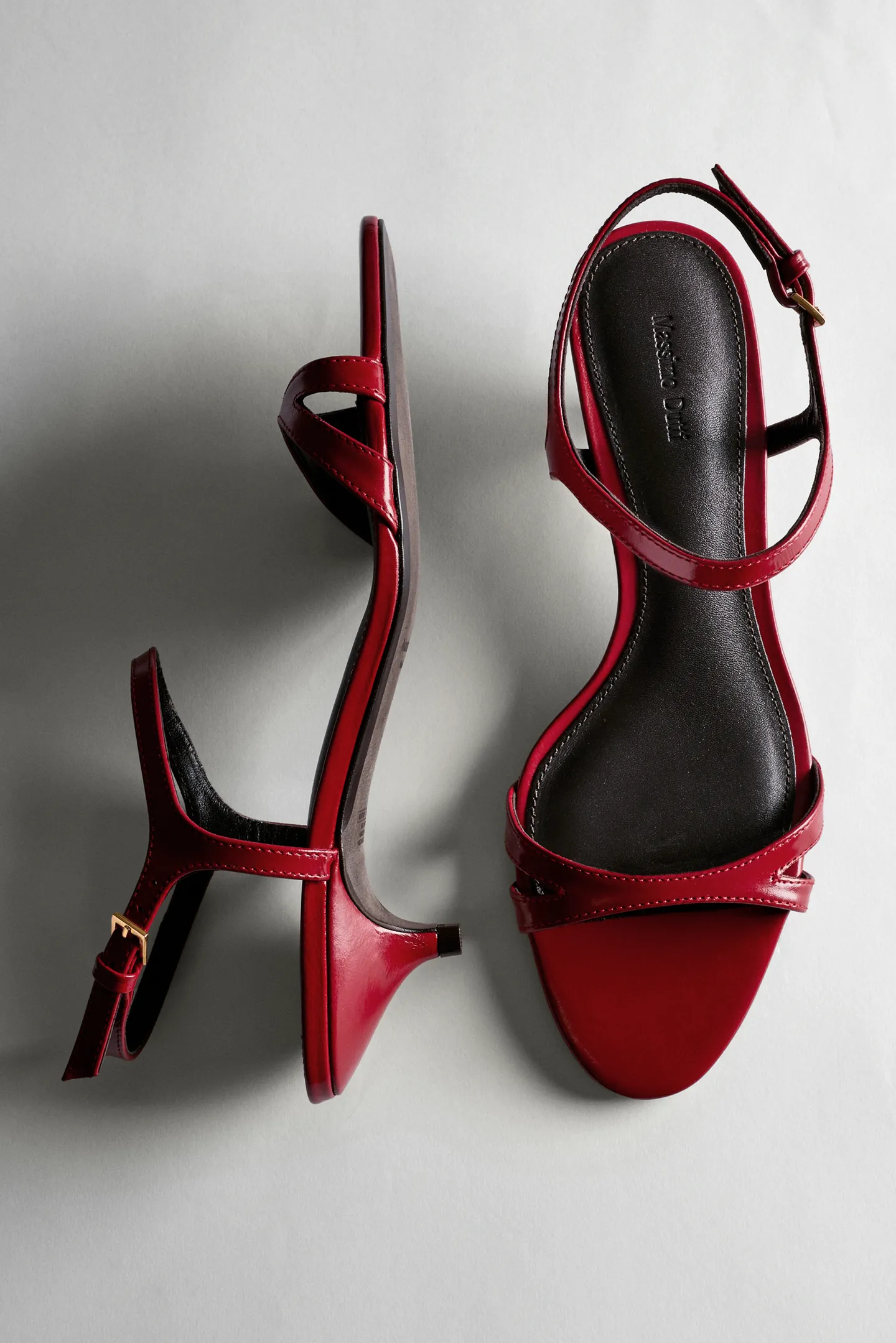 A pair of red Massimo Dutti strappy heels.