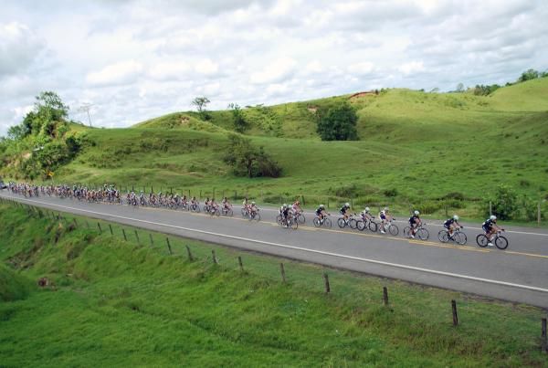 The peloton rides through the countryside on stage eleven.
