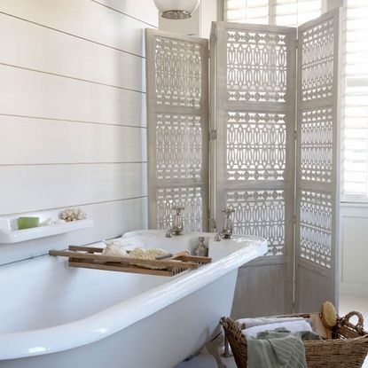 neutral bathroom with screen and bath