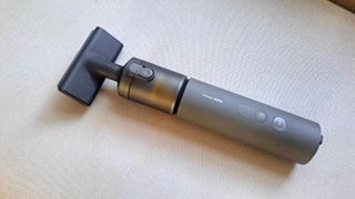 HOTO mini handheld vacuum on sofa