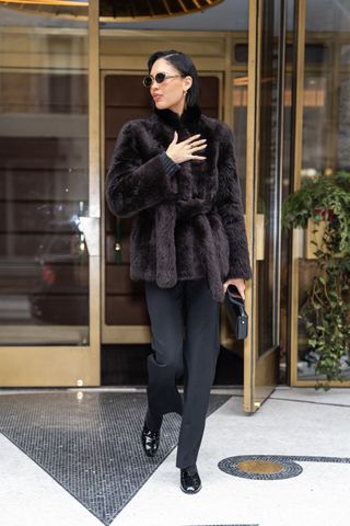  Nara Smith is seen in SoHo on February 02, 2025 in New York City wearing a fur coat, black trousers, and patent leather Chanel flats.