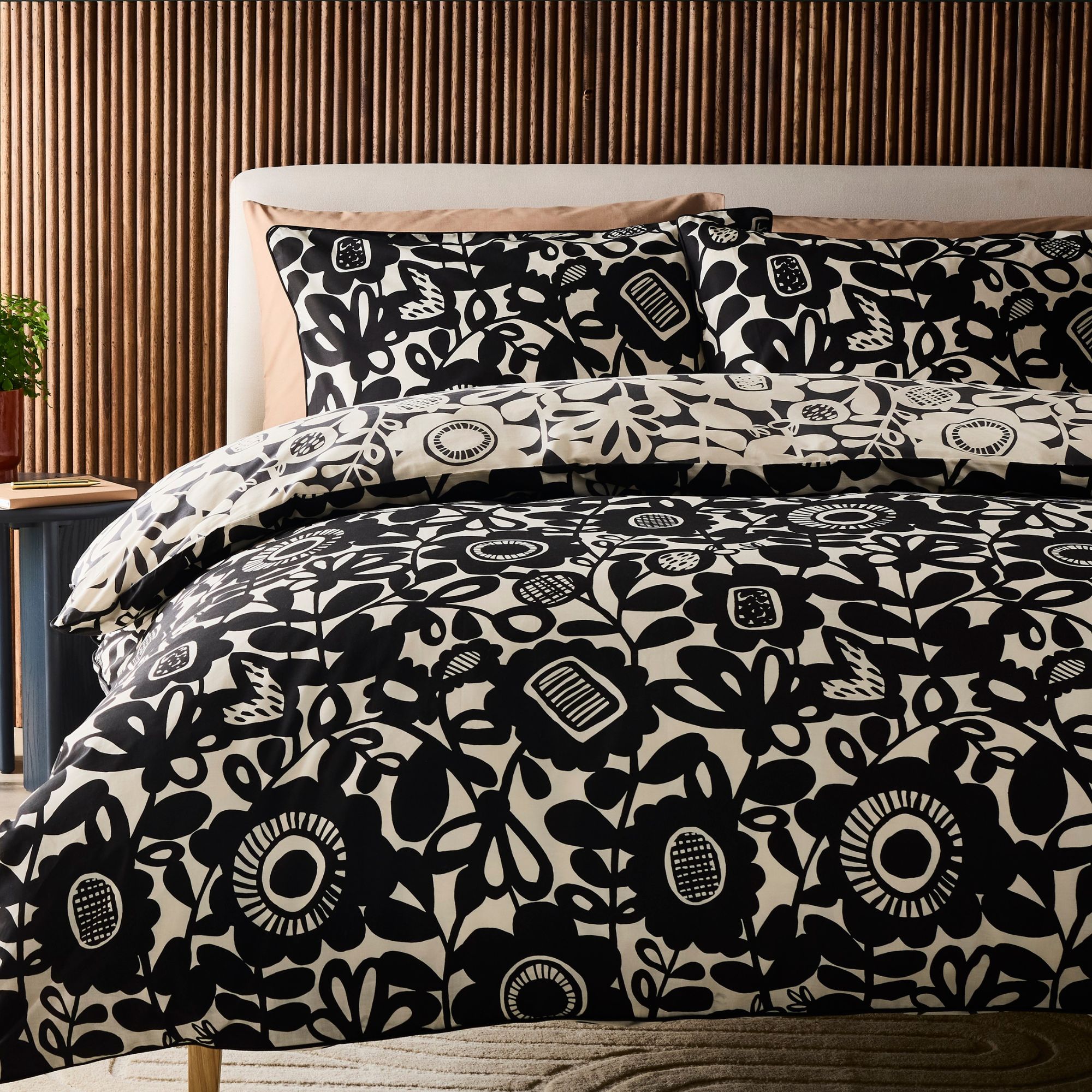 Habitat x Scion monochrome bedding, white background with bold black florals