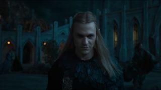 Annatar/Sauron smirks as he walks towards the camera in The Rings of Power season 2